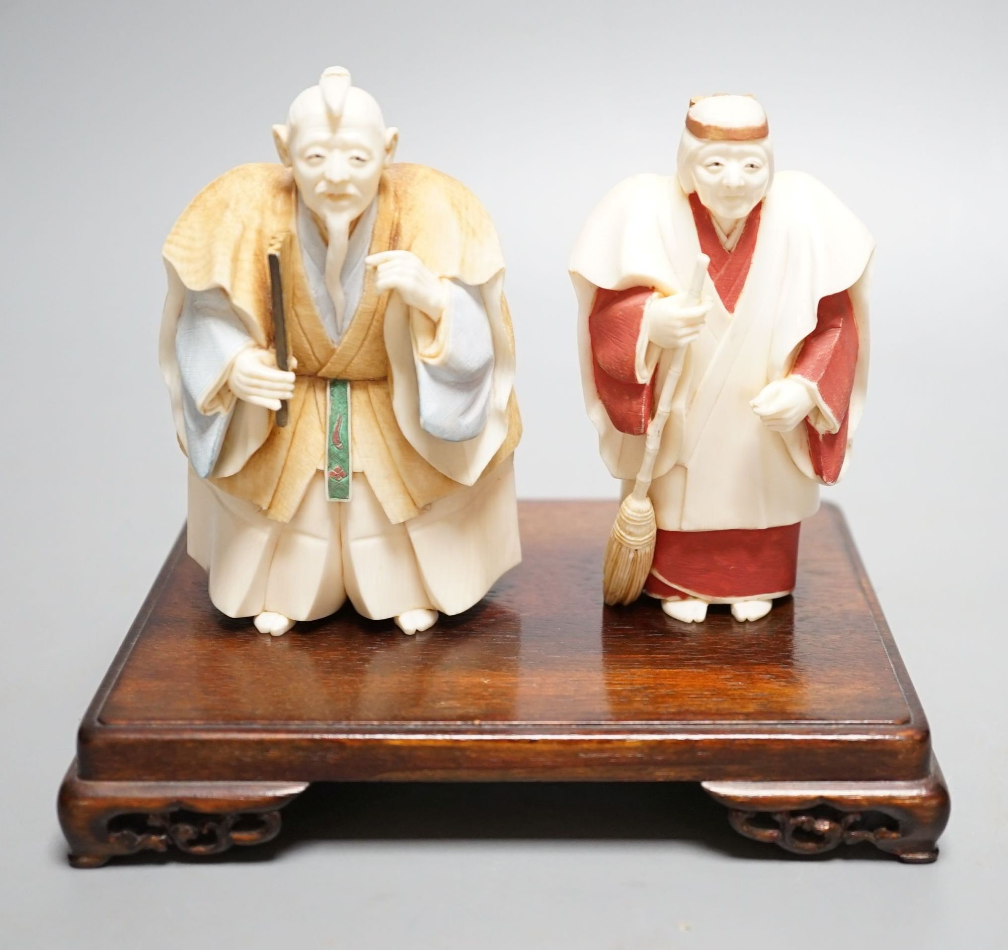 Two Japanese stained ivory figures of court servants, Taisho/early Showa period, signed - tallest 11cm